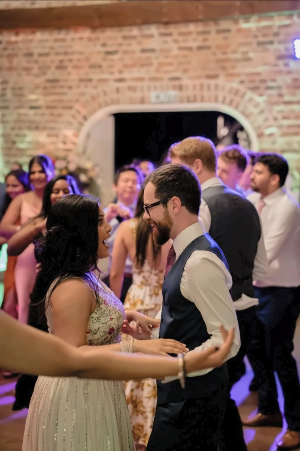 Couple sharing a joyful dance together at a wedding reception