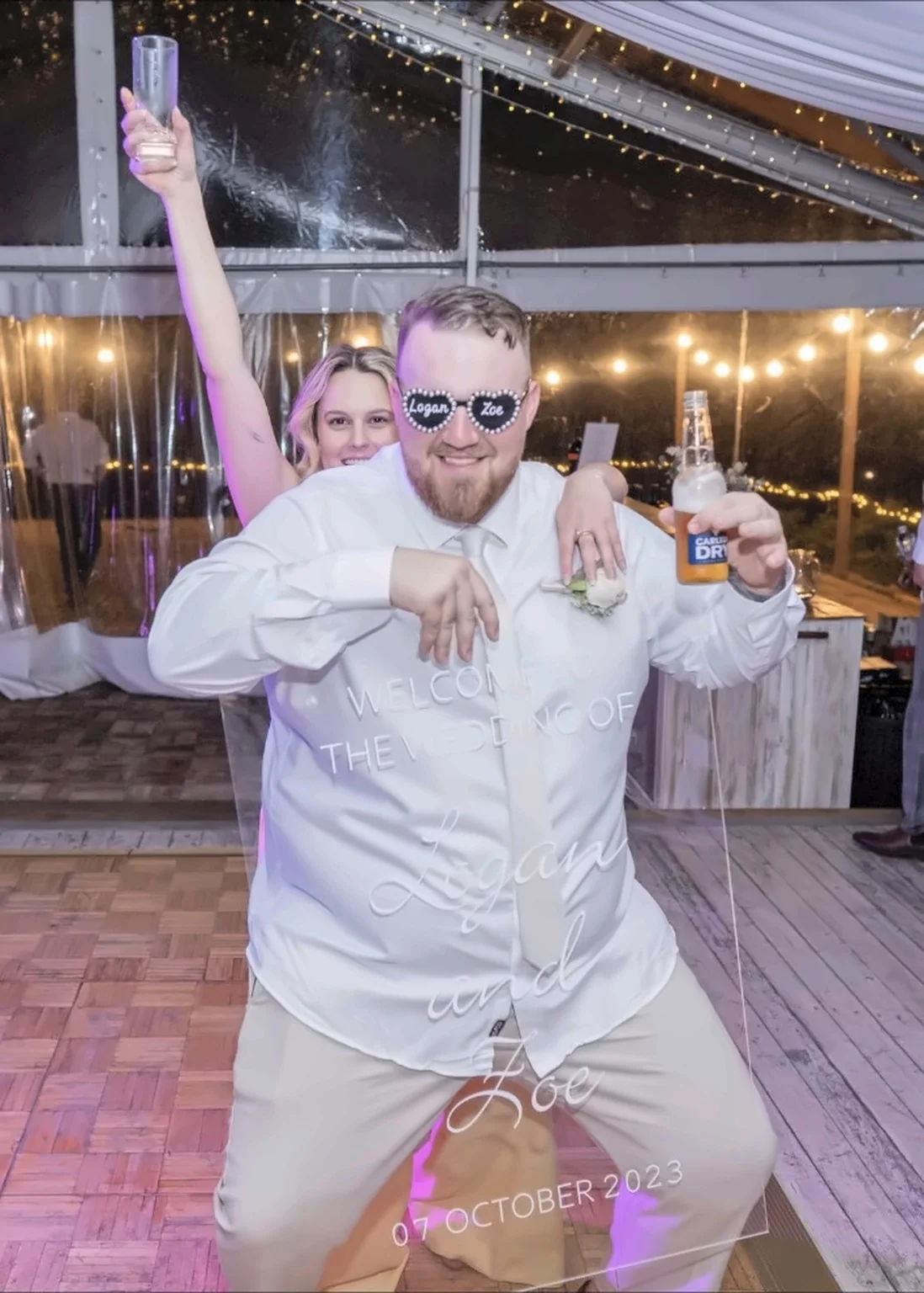 Guest celebrating with fun glasses at a wedding reception