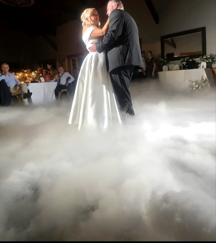 Real first dance with low-cloud effect at a wedding