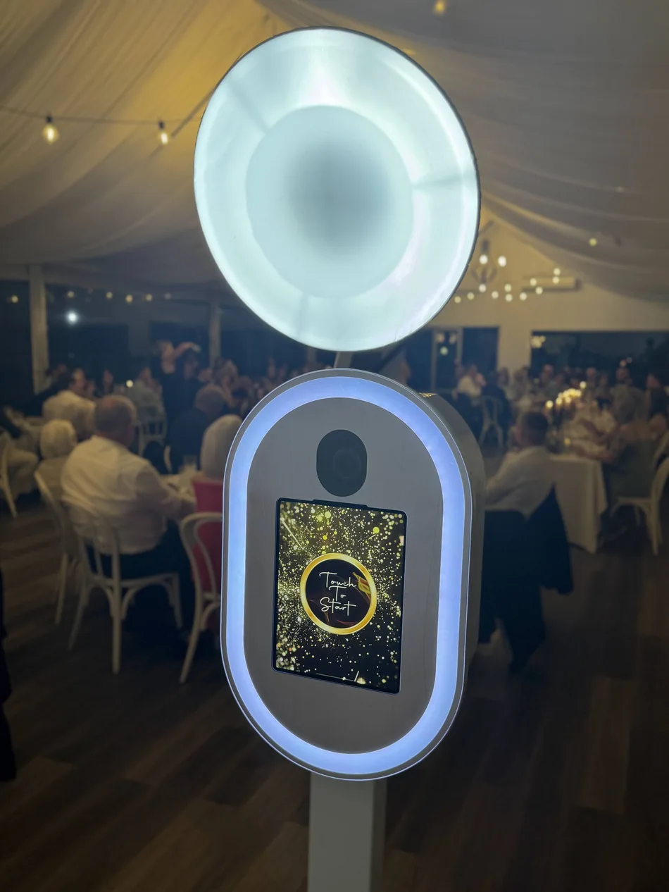 Real Selfie Station facing wedding guests